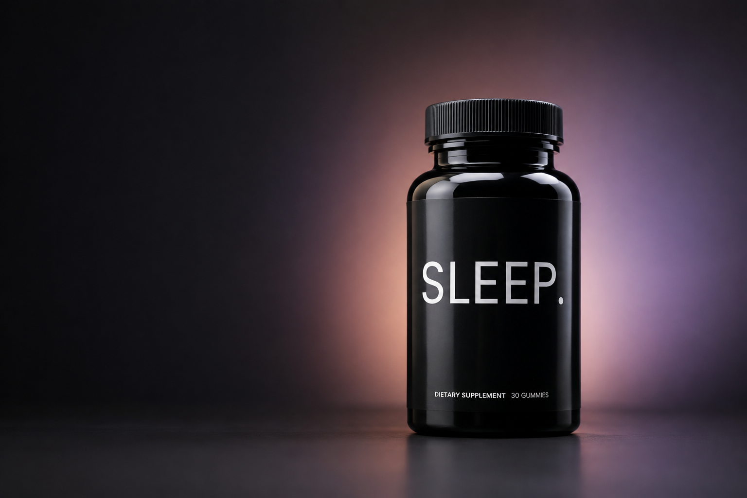 Sleep gummies bottle in a black studio with a soft lavender and peach glow